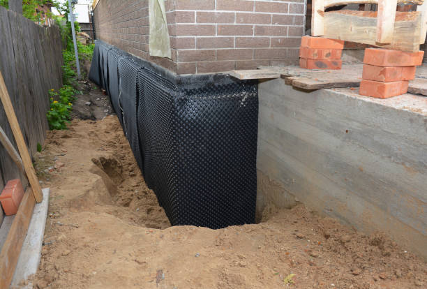 Happy homeowners after waterproofing job in Roachdale